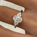 Oval lab-grown diamond engagement ring with round accent diamonds