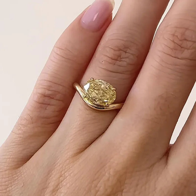 Oval-cut lab-grown diamond ring with side-stone accents