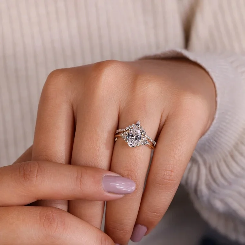 Gold curved wedding band with pear and round diamonds