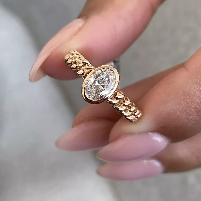 Oval lab-grown diamond bezel-style engagement ring