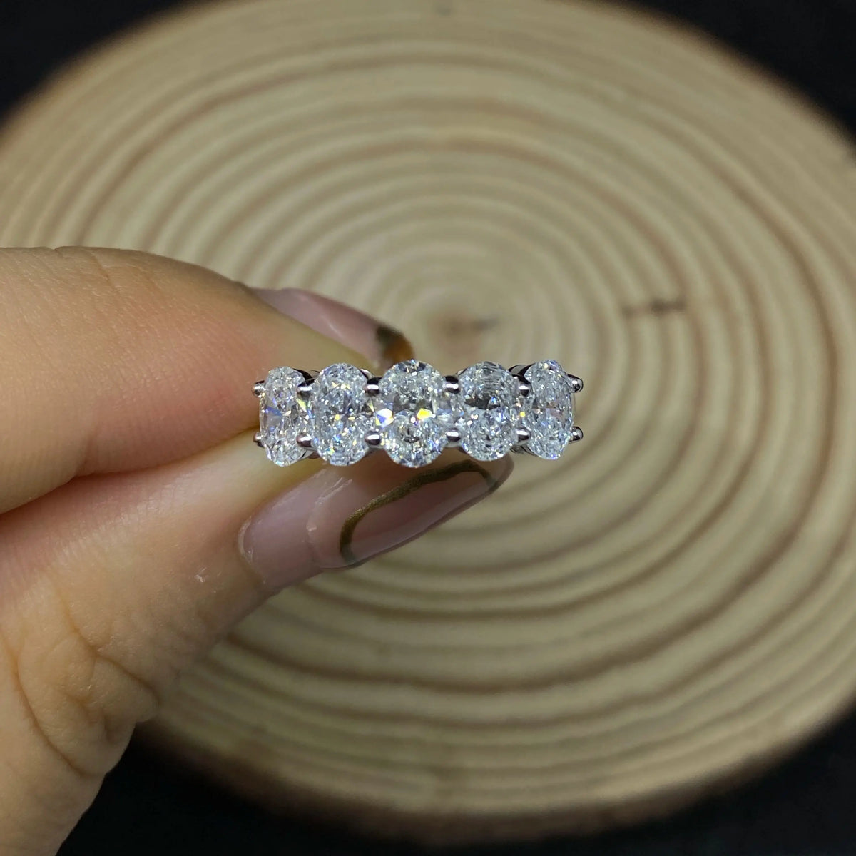 Oval diamond five-stone ring with prong-set stones