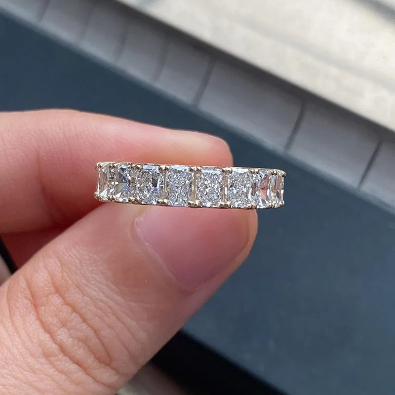 Half-eternity radiant diamond ring