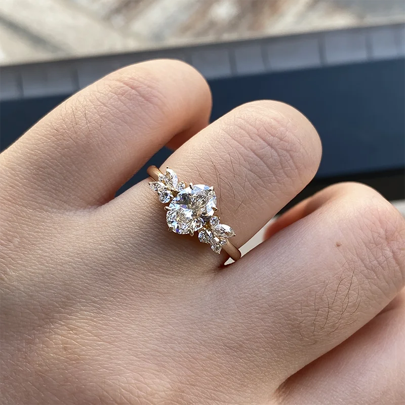 Gold oval lab-grown diamond ring with delicate diamond accents