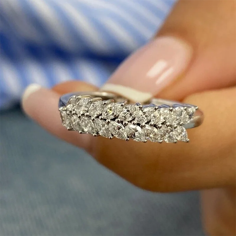 Gold wedding band with marquise-shaped lab-grown diamonds