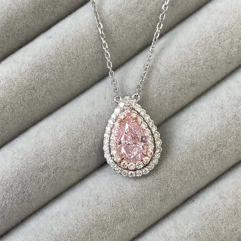 Pink pear-cut diamond pendant with round diamond accents
