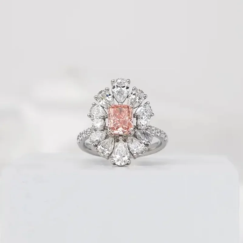 Pink radiant-cut lab-grown diamond ring with side stones