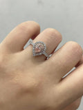 Pink pear-cut lab-grown diamond ring with diamond accents